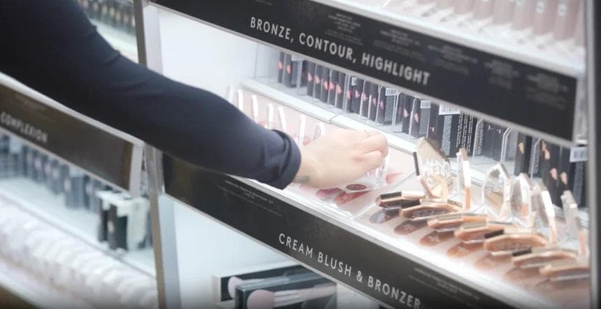 a woman buying makeup